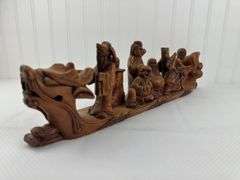 Carved elephants and Buddhist boat
