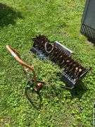 Pull behind lawn aerator on utility dolly