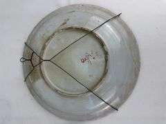 Pair antique hand painted decorative wall plates (one previously repaired)
