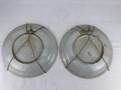 Pair antique hand painted decorative wall plates (one previously repaired)