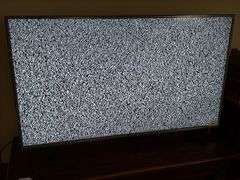 60" LG television with remote