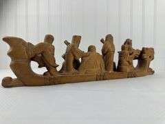 Carved elephants and Buddhist boat