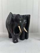 Carved elephants and Buddhist boat