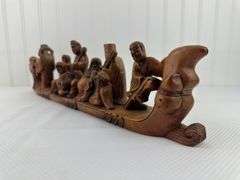 Carved elephants and Buddhist boat