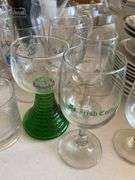 Clear glass pitcher, bar glasses, beer guide book
