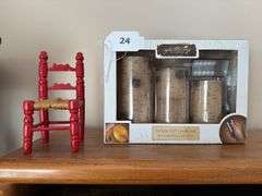 Led candle set, pair of candle holders made from WW II shell casings, tin box, photo albums, misc