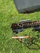 Pull behind lawn aerator on utility dolly