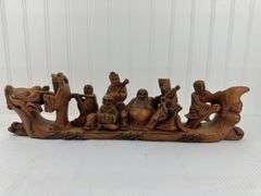 Carved elephants and Buddhist boat
