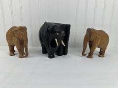 Carved elephants and Buddhist boat