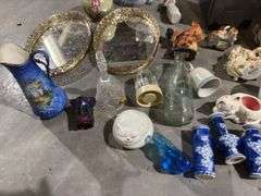 Tub of misc: mirrored tray, brass hurricane lamp, willow tree figure, carnival glass toothpick, glass vases, brass candle holder, figurines