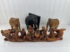 Carved elephants and Buddhist boat