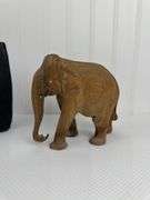 Carved elephants and Buddhist boat
