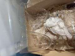 3 tubs of misc: cake stand, stone wave, light bulbs, vases, Tupperware, carafe, 6 crystal glasses, 9 Apolo glasses
