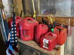 5 plastic gas cans, flags