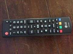 60" LG television with remote