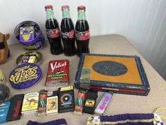 Misc Camel and Smokin’ Joe’s lighters, tins, crown bags, cigar box, coca-cola collector bottles Nascar themed