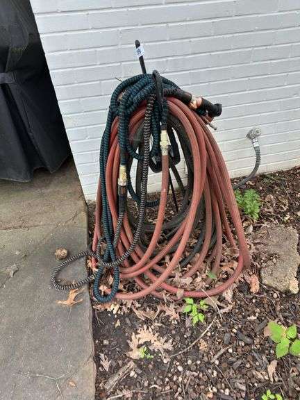 All garden hoses and stand ( in front of house & back) image