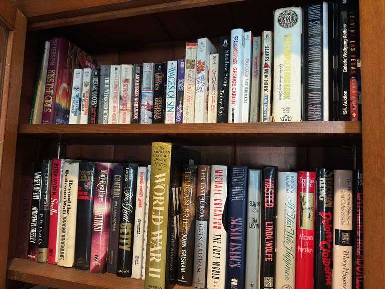 Top 2 shelves of hardback and paper back books