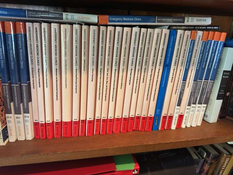 2 shelves of books mostly medical