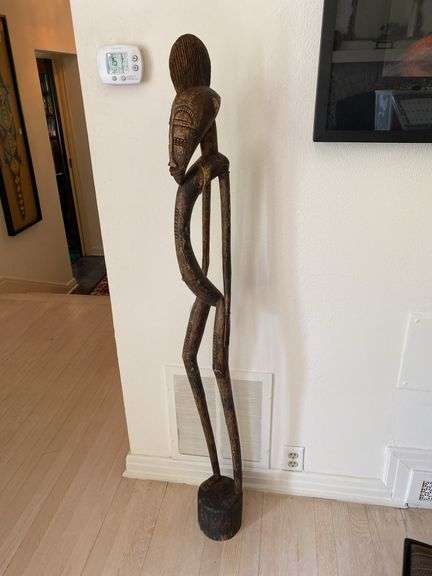 Primitive African wood carved 56” h statue