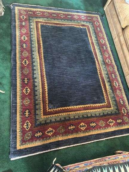 Hand knotted wool rug (missing some edging) 58” x 77”