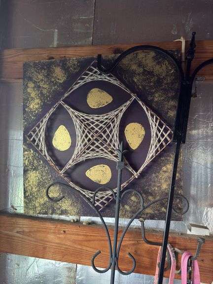 Shepard hooks, concrete angel, bag chair, artwork