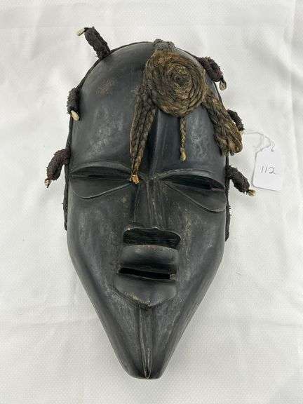 African Carved Tribal Mask with Braided Fiber and Cowrie Accents and Group of Tribal-Inspired Decorative Items image