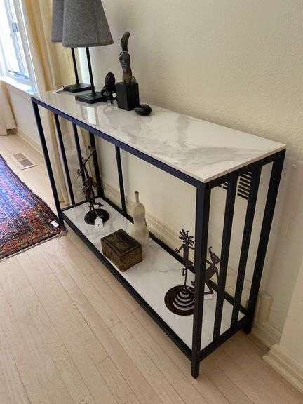 Metal framed entry table with marble top and bottom shelf 47”w x 12”d x 31”t, excludes all contents image