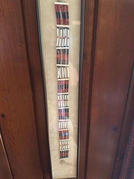 Beaded belt in frame