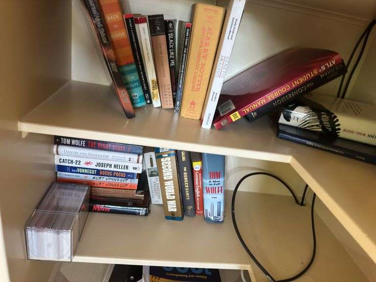 Bottom 2 shelves of books