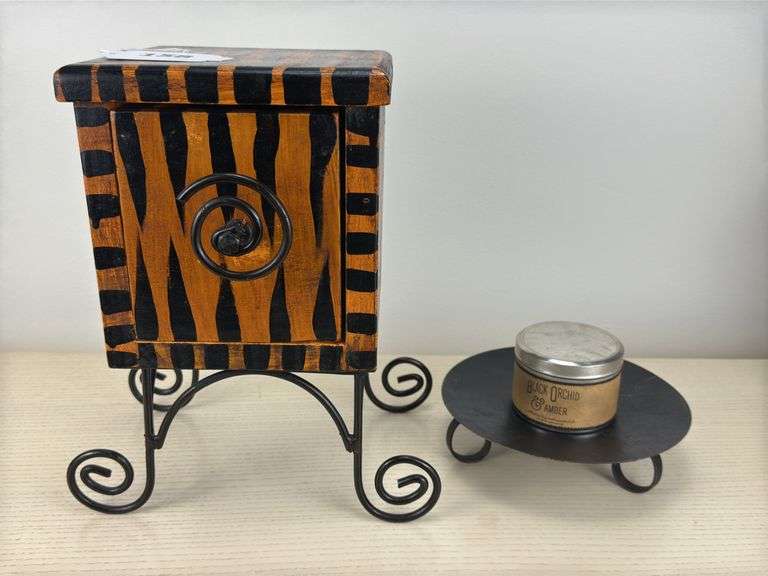 Decorative box on wire base, candle with base, black photo frames, books image