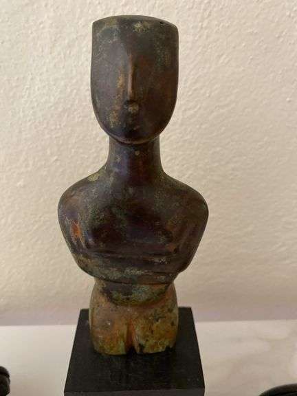 Stone carved figurine on wood base, lidded seed pod, etched egg on wood base