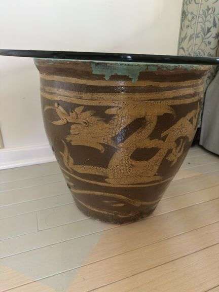30” glass top on top of large black egg Chinese planter