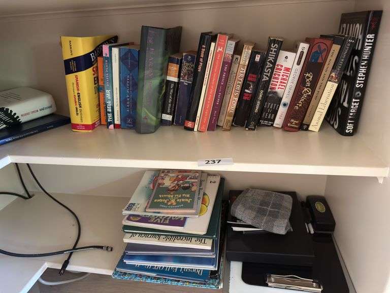 Bottom 2 shelves of books