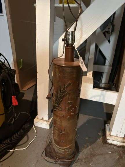40”h  lamp with sculpture details in basement without shade image