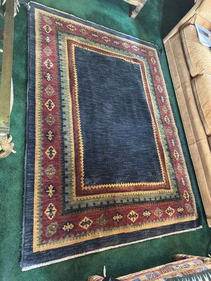 Hand knotted wool rug (missing some edging) 58” x 77”