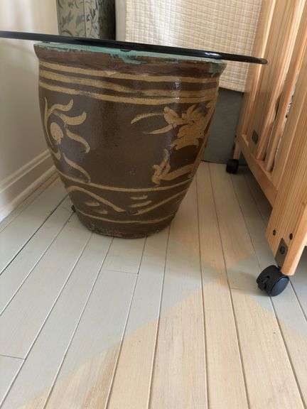 30” glass top on top of large black egg Chinese planter
