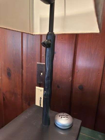 Lamp with metal tribal base