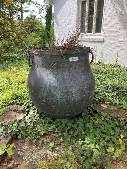 Very heavy cast iron pot with brass ring handles, 20”d x 24”h, (heavy items, must have your own help to load) image