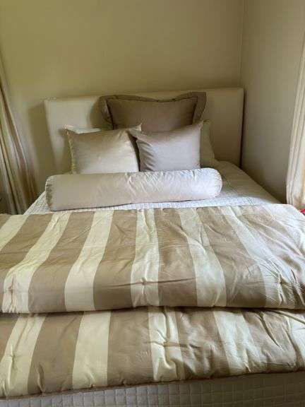 Full size upholstered ivory silk bed and bedding