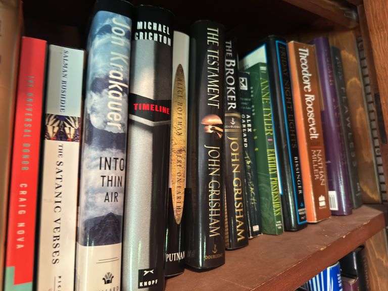 Top shelf of hardback and paperback books