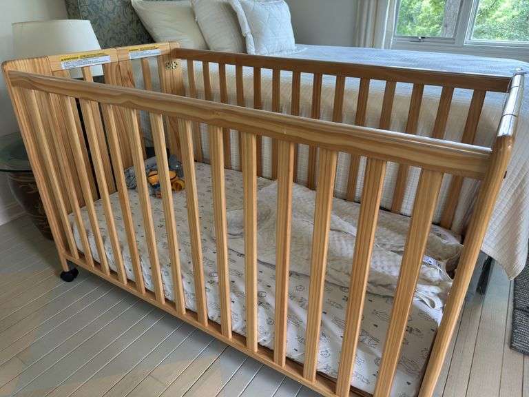 Foundations baby crib with mattress/ sheet , sleep sac & toys image