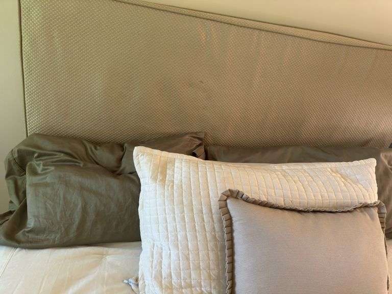Queen size bed with bedding. Upholstered headboard