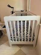 Crate and Kids white baby crib with mattress/ sheet. 54” l X 30” w