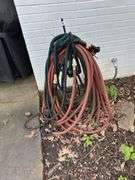 All garden hoses and stand ( in front of house & back)
