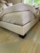 Full size upholstered ivory silk bed and bedding