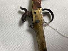 antique brass black powder pistol