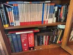 2 shelves of books mostly medical