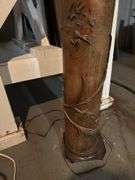 40”h  lamp with sculpture details in basement without shade