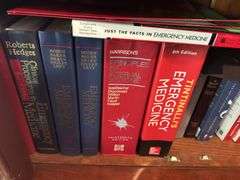 2 shelves of books mostly medical